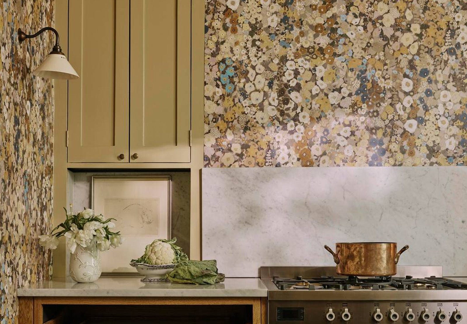 a kitchen with a pot and flowers