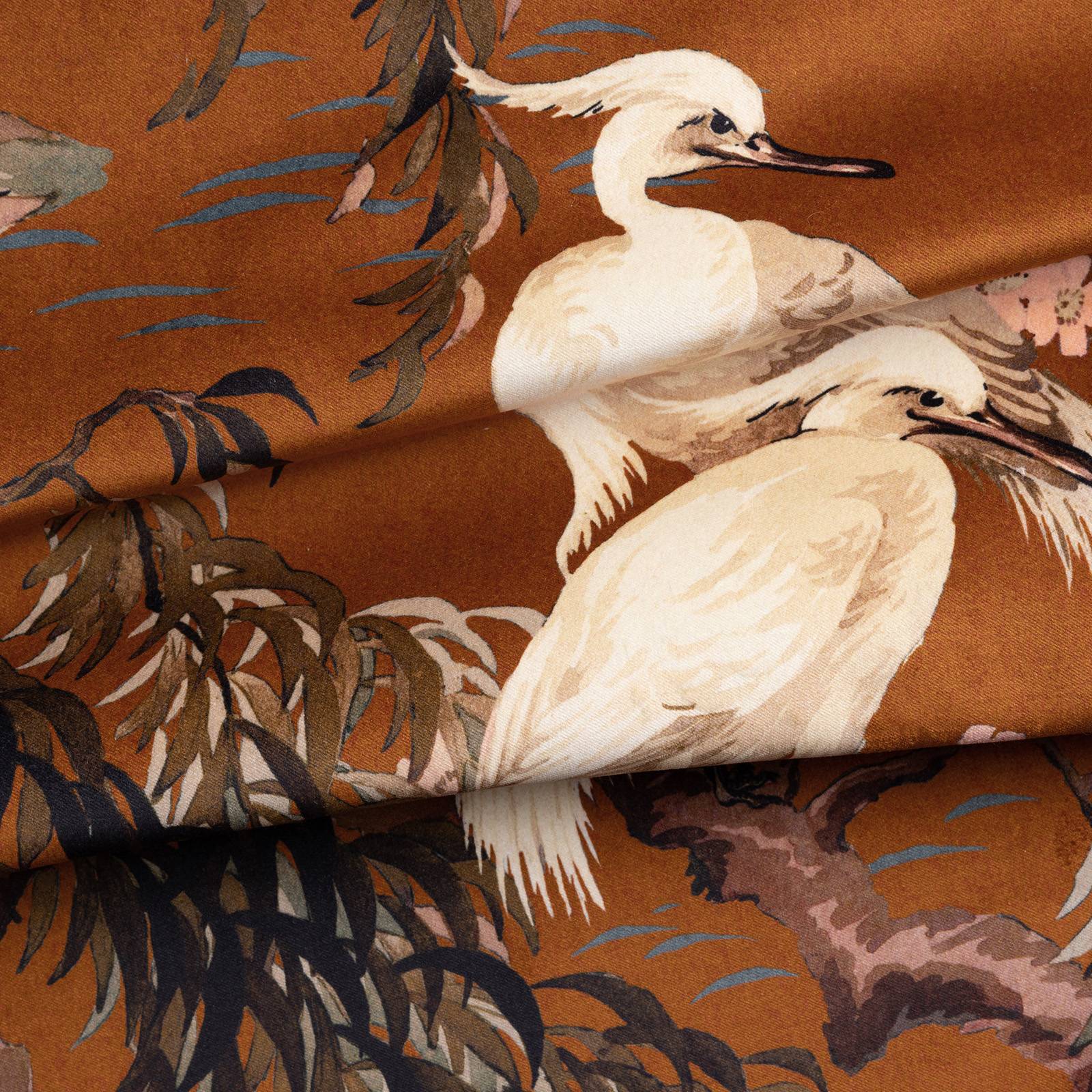 a fabric with birds and trees