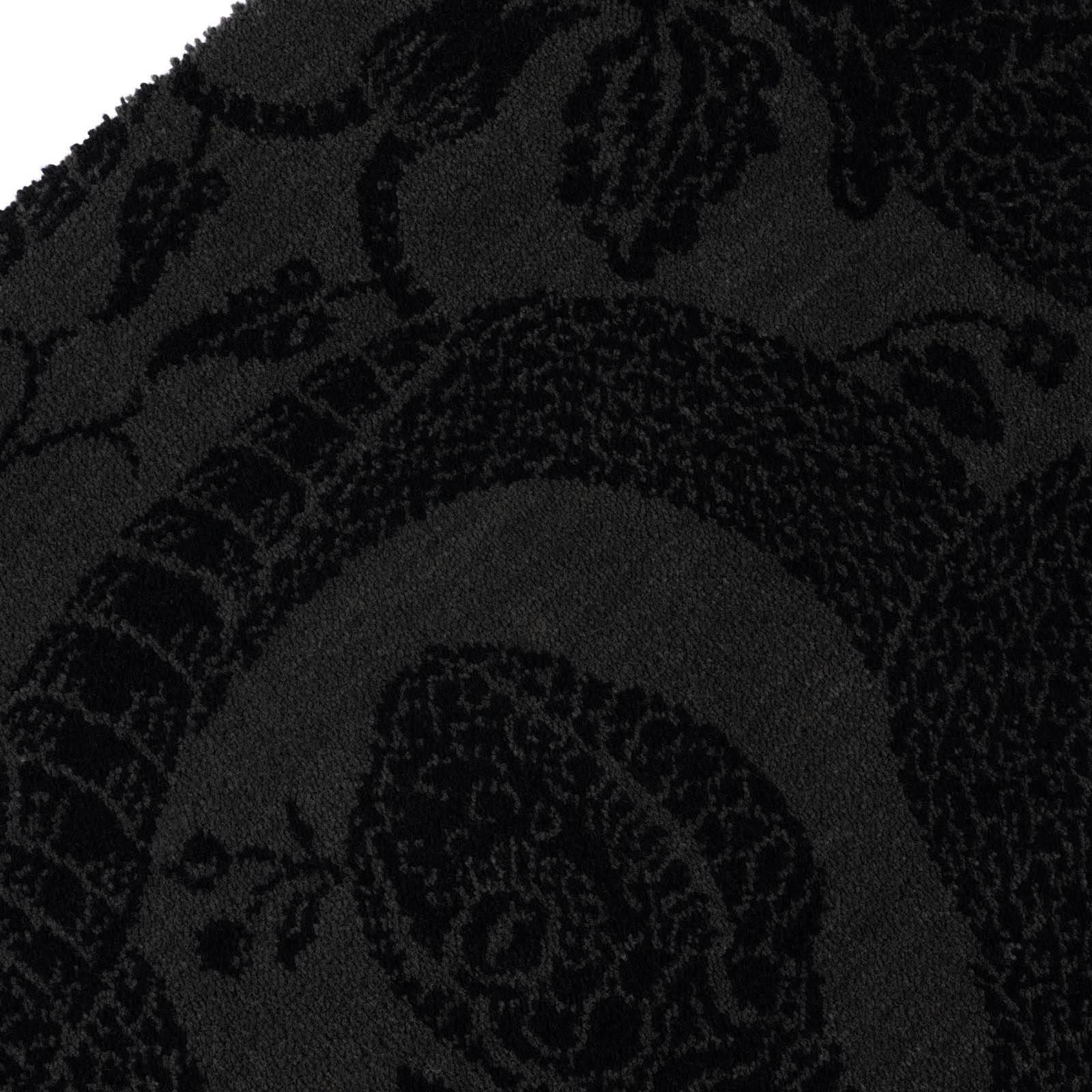 a close up of a black rug
