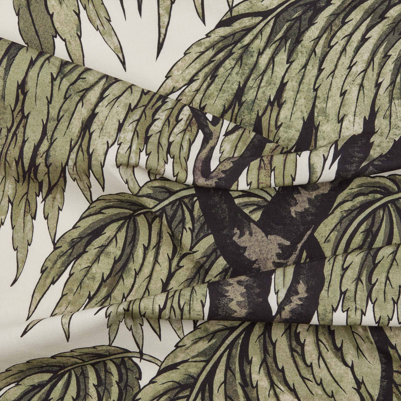 a fabric with a pattern of leaves