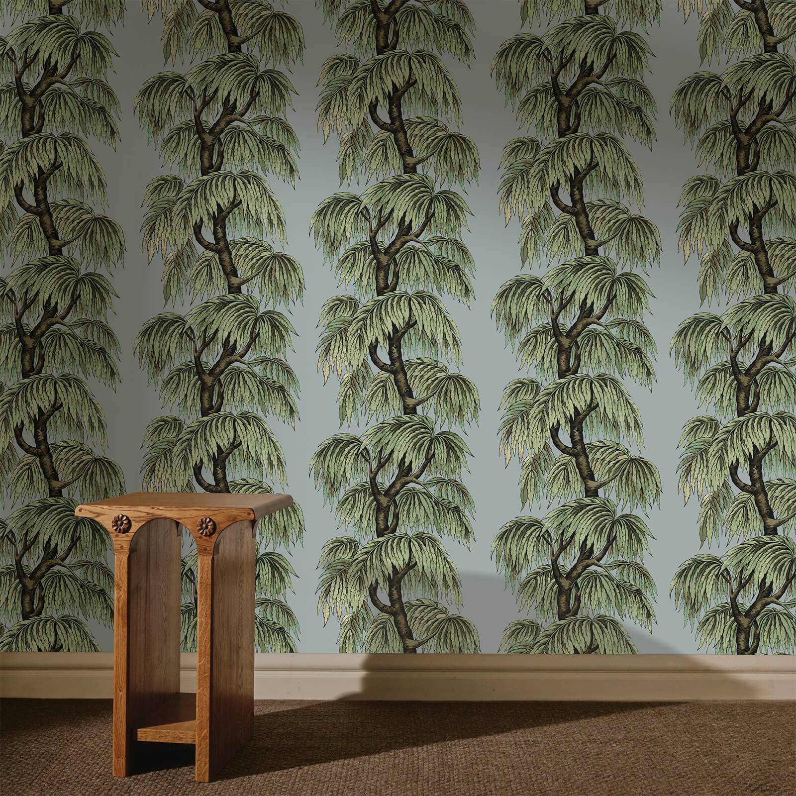 a wooden table in a room with a wallpaper