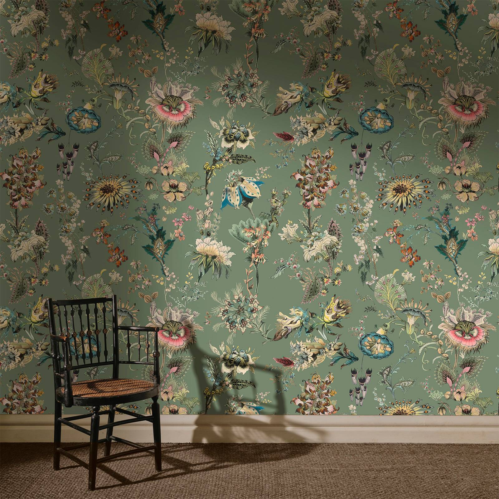 a chair in a room with floral wallpaper