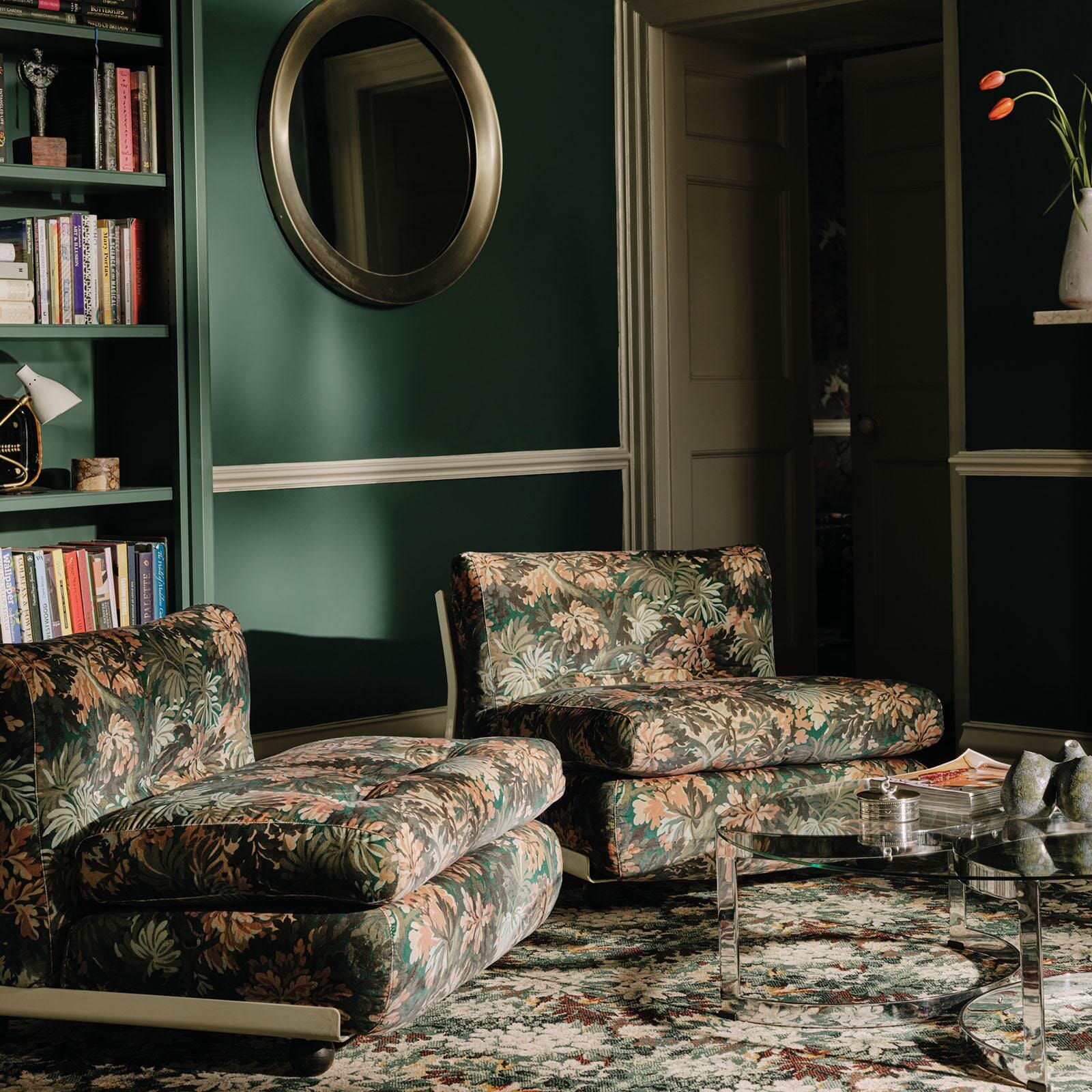 a living room with a chair and a coffee table